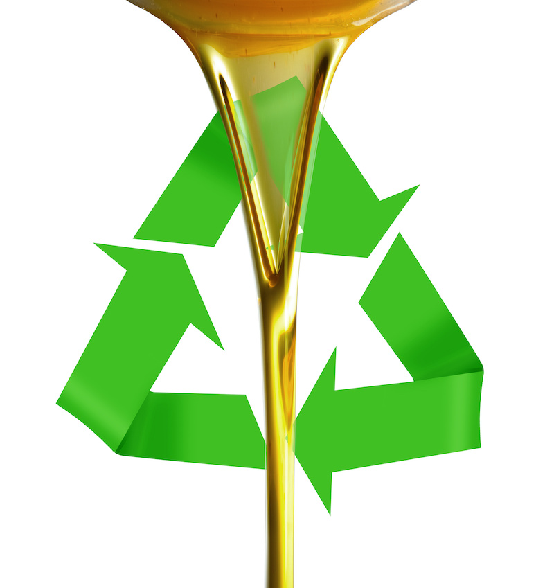 Pourin oil or golden liquid on recycle symbol
